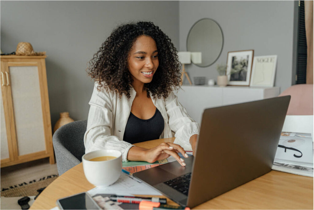 5 Simple Ways AI Can Help You Run a Solo Business Minimalist home office with laptop showing AI tools for solo business